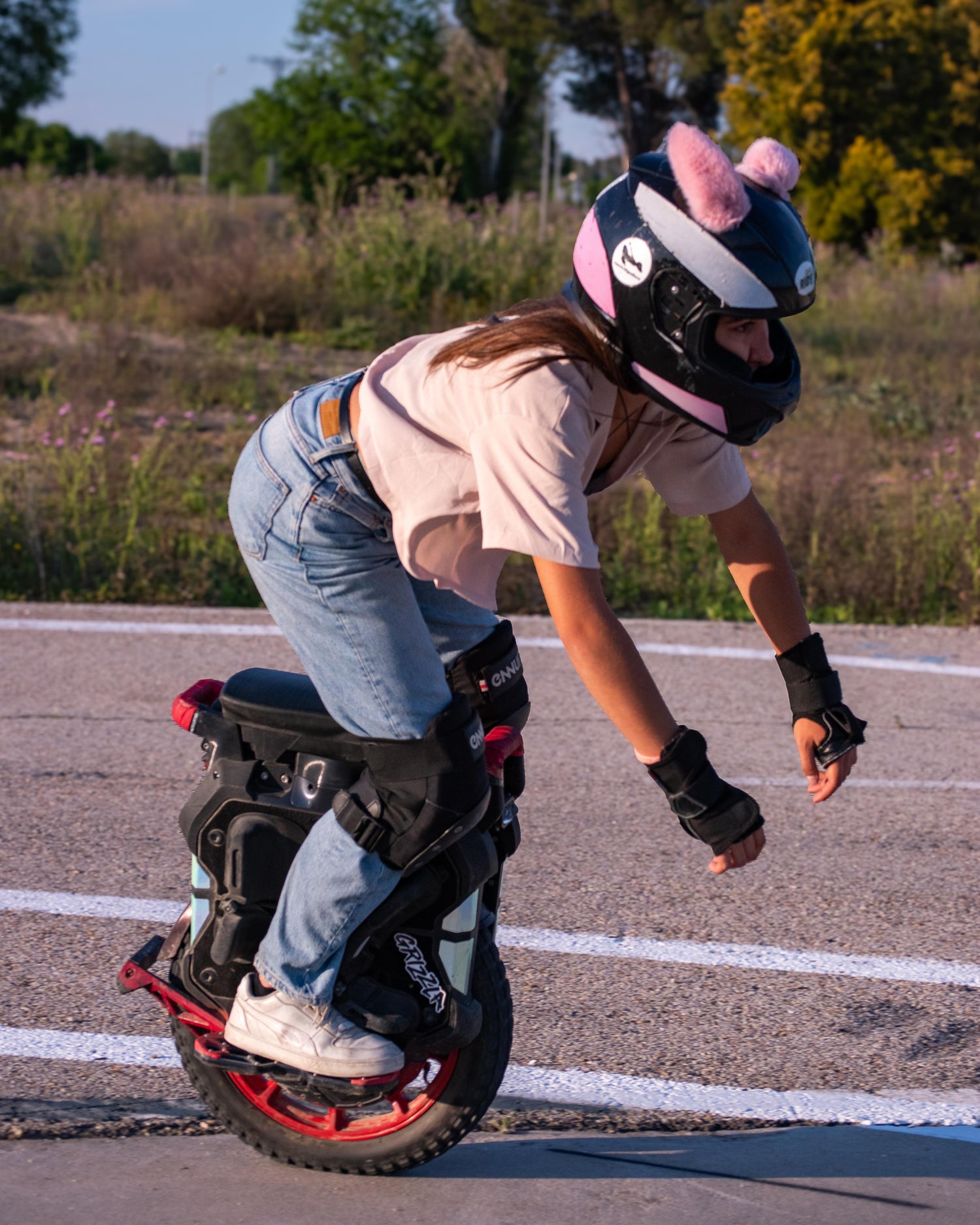 Pink bunny helmet EARS on a one-wheel rider